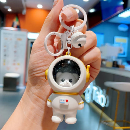 Llaveros para mochilas escolares con forma de gato astronauta, luz nocturna brillante de ZAKOL.